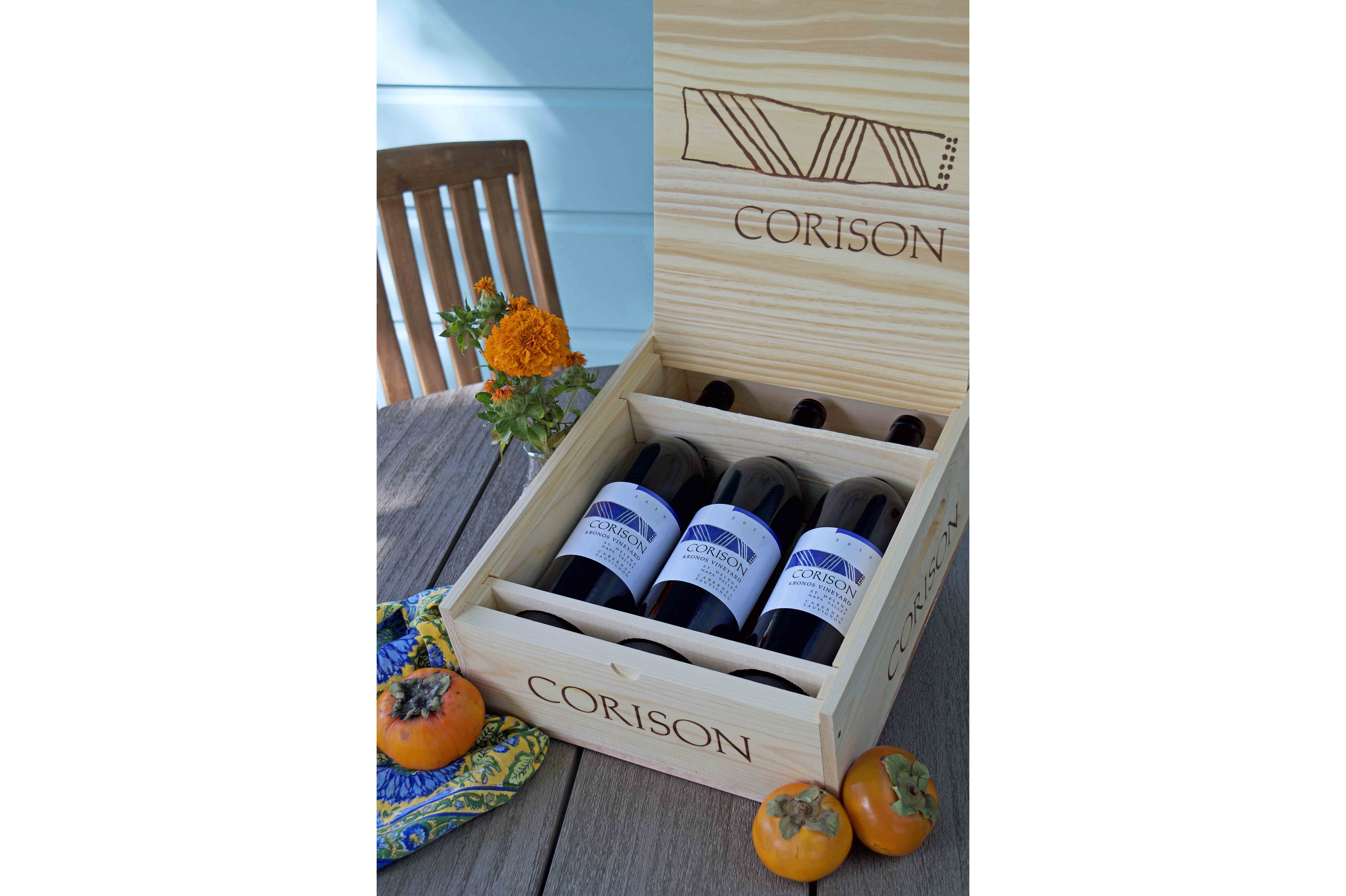 Three bottles of the 2020 Corison Kronos Vineyard Cabernet Sauvignon on a fall holiday table