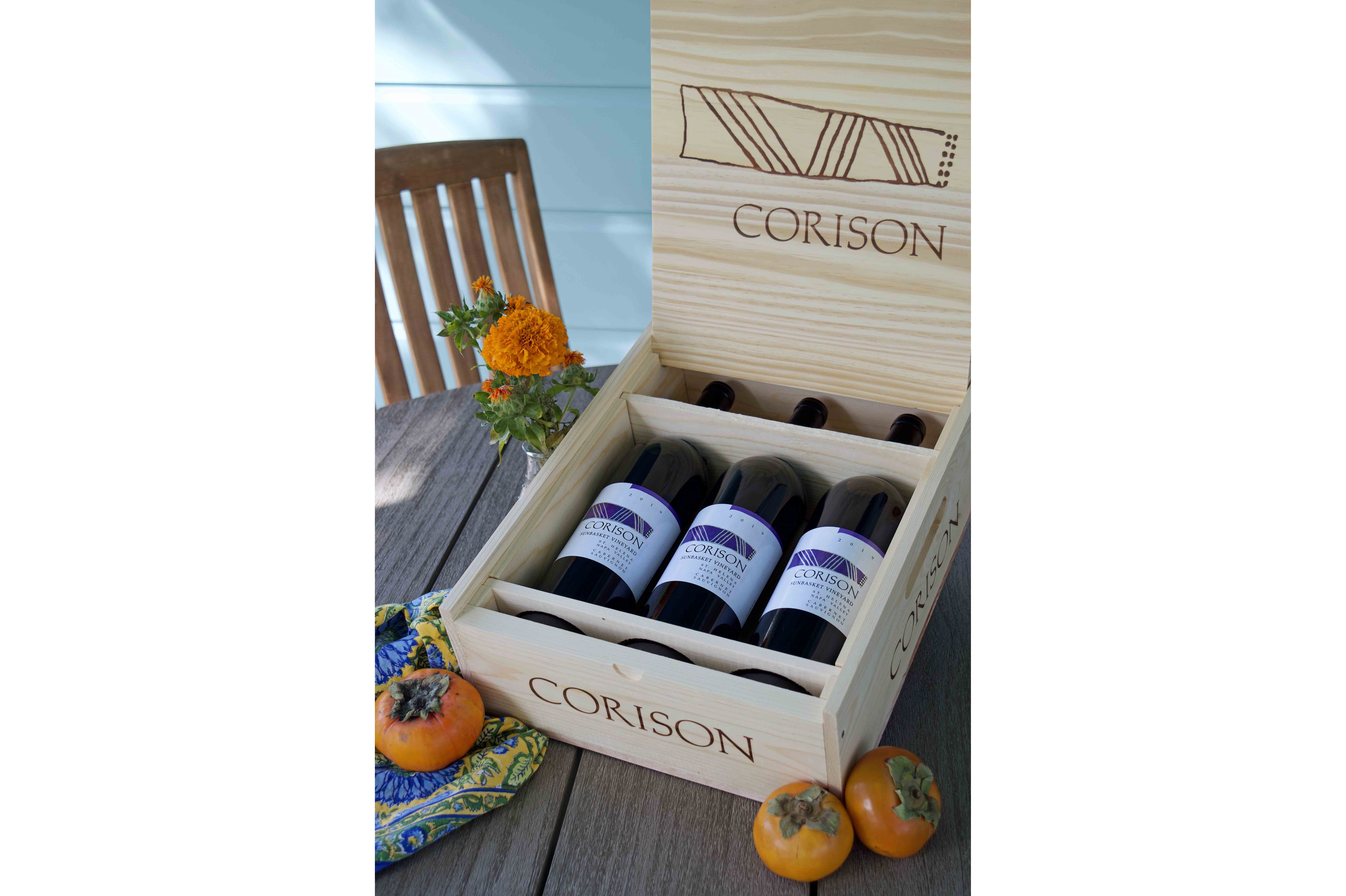 Three bottles of the 2020 Corison Sunbasket Vineyard Cabernet Sauvignon on a fall holiday table